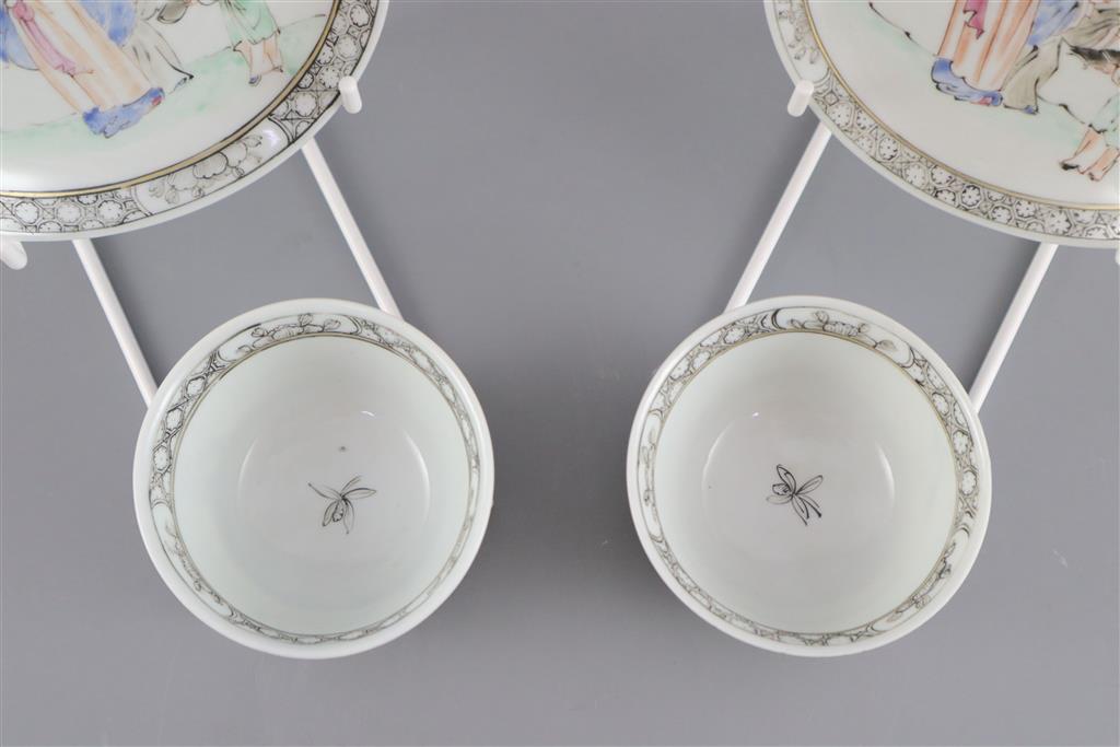 A pair of Chinese famille rose sages tea bowls and saucers, Qianlong period, saucers 11.7cm diameter